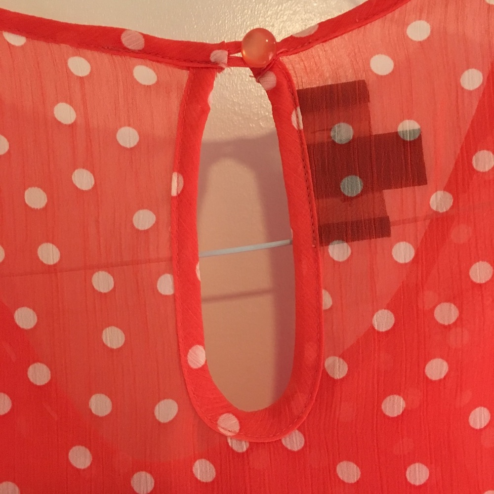 Orange Polka-dot tank top blouse.